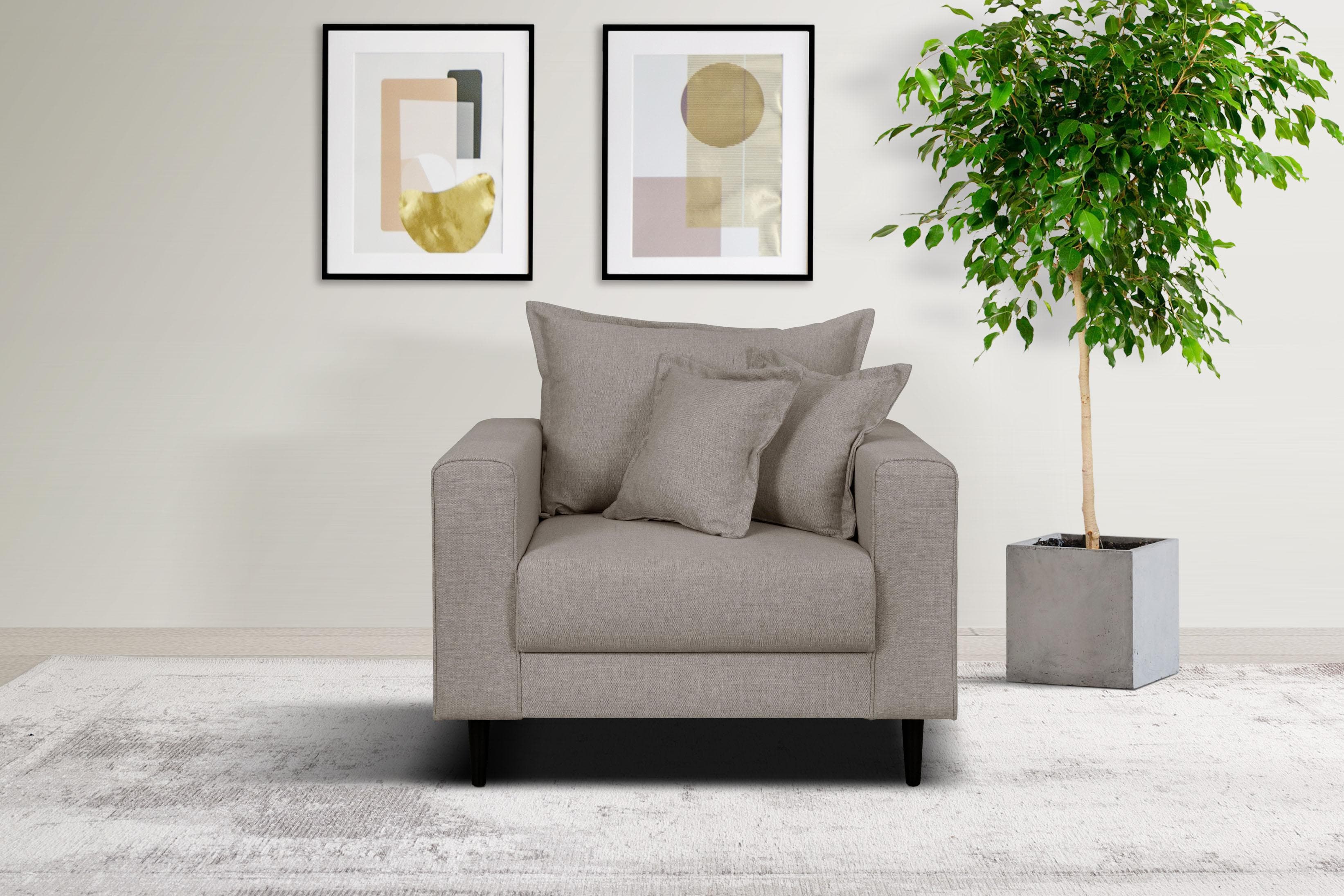 Gemütlicher Sessel mit Kederkissen und losem Rückenkissen